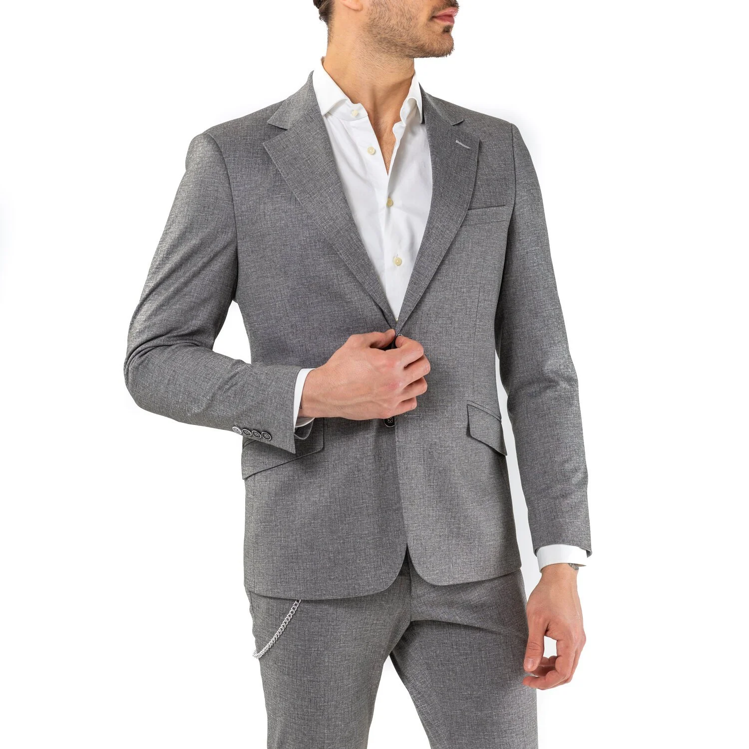 A man wearing a gray suit and white dress shirt.