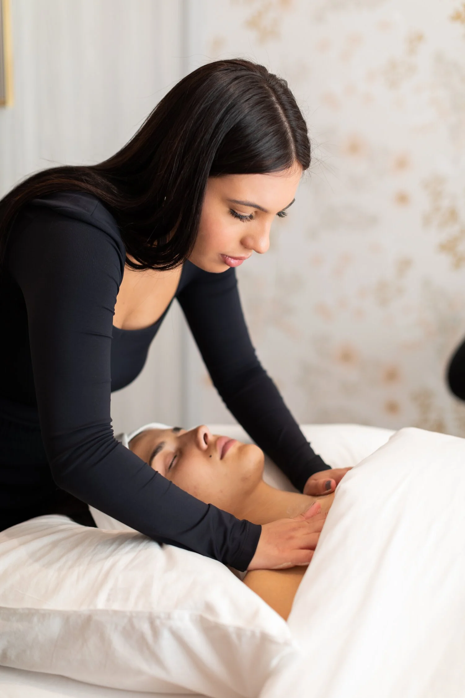 Woman receiving a massage in a spa setting.